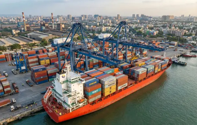 Container ship at port handling international sea freight shipments