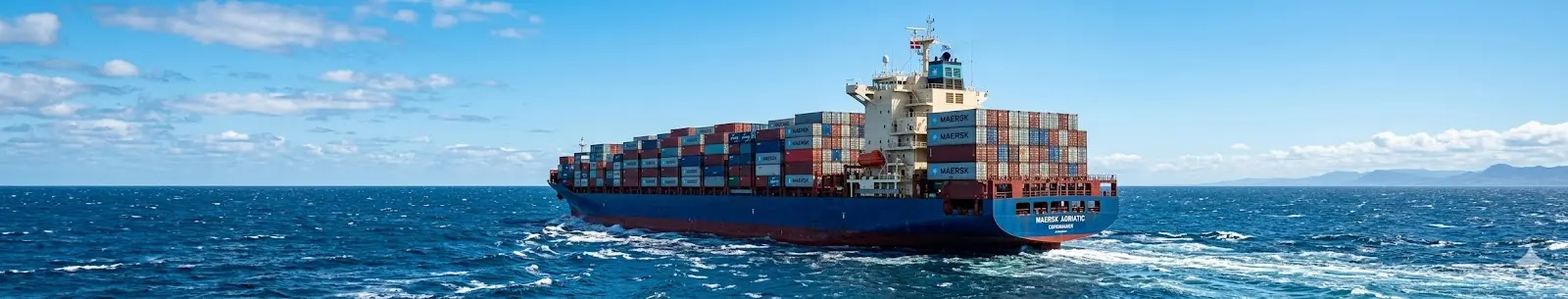 Container ship sailing at sea for global freight and shipping services